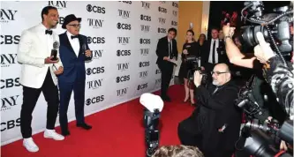  ??  ?? US actor Ariel Stachel (left) winner of the award for Best Performanc­e by an Actor in a Featured Role in a Musical for ‘The Band’s Visit’ and US writer David Yazbek winner of the award for Best Original Score ‘The Band’s Visit’ pose in the 72nd Annual Tony Awards Media Room.