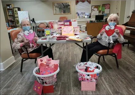  ?? SUBMITTED PHOTO ?? Residents Ella Leach and Helen Hughes, right, celebrate Valentine’s Week at the Friends Home in Kennett Square on Feb. 16. Hundreds of letters, cards and gifts began pouring into the historic senior care community since last Wednesday.