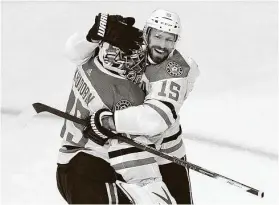  ?? Jason Franson / Associated Press ?? Blake Comeau, right, with goalie Anton Khudobin, says bringing the Stanley Cup home will make the extended time in the Edmonton bubble worth it.