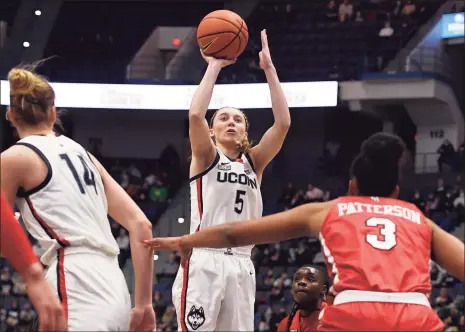  ?? Jessica Hill / Associated Press ?? UConn’s Paige Bueckers shoots against St. John’s in the first half on Friday in Hartford.