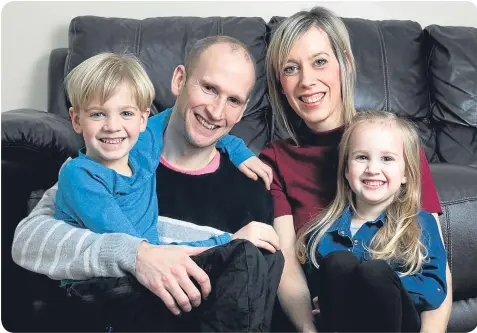  ??  ?? Alfie, pictured with parents John and Laura and sister Ava, is healthy and happy after overcoming encephalit­is.