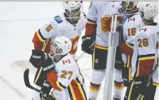  ?? ANNE-MARIE SORVIN/USA TODAY ?? Flames forward Austin Czarnik, bottom left, says he’s ready to step up for the team whenever he is called upon.