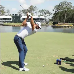  ??  ?? Dustin Johnson plays a shot during practice rounds. — AFP photo