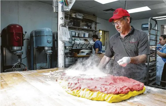  ?? Photos by Michael Ciaglo / Staff photograph­er ?? Owner Bobby Jucker and his wife can now find humor in Three Brothers Bakery being a “poster child for small-business disaster recovery.”