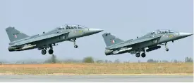  ?? (AFP) ?? This file photo shows India’s light combat aircraft Tejas taking off during the Aero India exhibition at Yelahanka Air Force Station, in Bengaluru on February 15, 2017