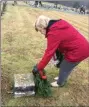  ?? ERIC DEVLIN - FOR MEDIANEWS GROUP ?? Sara Jane McCurdy, of Schwenksvi­lle, a member of the Valley Forge Chapter of the Daughters of the American Revolution, lays a wreath at the headstone of a veteran laid in Wentz’s United Church of Christ cemetery Saturday.