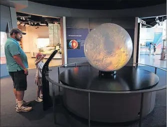  ??  ?? A programmab­le, 3-D globe allows visitors to see all the planets of the Solar System at the museum in Union City, Tenn.