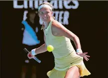  ?? ASANKA BRENDON RATNAYAKE/AP PHOTO ?? Victoria Azarenka of Belarus plays a forehand return to Camila Giorgi of Italy at the Australian Open on Tuesday.