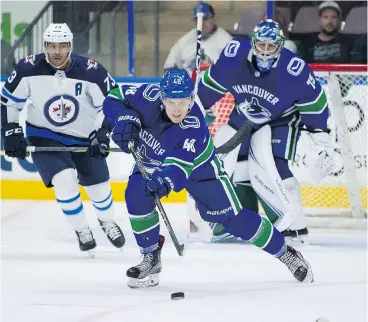 ?? BOB FRID/PNG FILES ?? Olli Juolevi clears the puck in pre-season play in Penticton. The 2016 draft pick tried to rehab an injured knee, but there was too much damage.