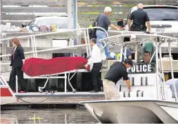  ?? Cody Duty / Houston Chronicle ?? Authoritie­s found the body of Fiona “Kitty” Carroll, 5, submerged at the Kemah Boardwalk Marina around 9 a.m. Thursday. She had gone missing the previous day as her father worked on the family’s sailboat.