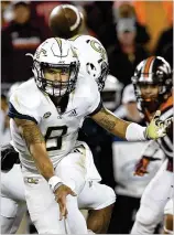  ?? MICHAEL SHROYER / GETTY IMAGES ?? Tech QB Tobias Oliver, starting for an injured TaQuon Marshall, rushed for 215 yards and three TDs on 40 carries in a 49-28 rout of host Virginia Tech on Thursday.