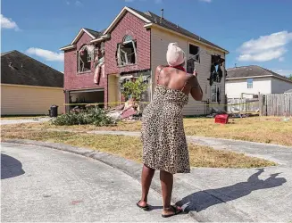  ?? Photos by Raquel Natalicchi­o/Staff photograph­er ?? The damage to the home that authoritie­s tore through to reach Terran Green was likely justified by law enforcemen­t because Green was accused of shooting multiple officers, one expert said.