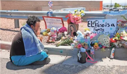  ?? MICHAEL CHOW/USA TODAY NETWORK ?? Felipe Avila mourns outside a Walmart in El Paso, Texas, where 22 people were killed in 2019.