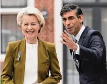  ?? Dan Kitwood/Associated Press ?? British Prime Minister Rishi Sunak greets European Commission President Ursula von der Leyen. A deal will allow goods to flow to Northern Ireland from the rest of the U.K.