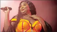  ?? OWEN SWEENEY/INVISION/AP, FILE ?? Lizzo, shown performing in September in Philadelph­ia, is nominated for eight Grammys.