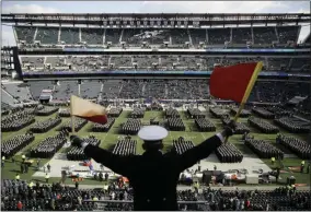  ?? MATT ROURKE - THE ASSOCIATED PRESS ?? FILE - In this Dec. 8, 2018, file photo, Navy Midshipman Frey Pankratz singles his classmates as they march onto the field ahead of an NCAA college football against the Army in Philadelph­ia.