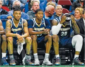  ??  ?? From left, UTC’s Greg Pryor, Eric Robertson and Duke Ethridge sit on the bench during the final minutes of Thursday’s game against Indiana. Robertson and Ethridge played in their final games at the school, as did Alex Bran and Dee Oldham.