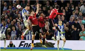  ?? Photograph: Robin Jones/Getty Images ?? Luke Shaw of Manchester United is punished for handball after a VAR check. Alexis Mac Allister scored from the penalty spot.