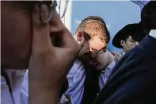  ?? Maya Alleruzzo/Associated Press ?? Mourners attend the funeral of Aryeh Schupak, 15, a dual Israeli-Canadian citzen, killed Wednesday in a bus stop blast.