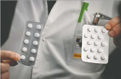  ?? GETTY IMAGES FILES ?? Packets of Nivaquine, tablets containing chloroquin­e, and Plaqueril, tablets containing hydroxychl­oroquine. Chloroquin­e and hydroxychl­oroquine are the drugs now being tried for COVID-19 infections, but it remains to be seen if their use is effective, Joe Schwarcz writes.