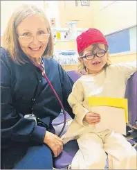  ?? SUBMITTED PHOTO ?? Norah Cameron-Ranni, right, sits with Nurse Small, one of her favourite people at the Hospital for Sick Children in Toronto in August. An eye infection forced Norah and her mother to travel last-minute to the hospital with flights alone costing the family $3,600. MSI provides a maximum of $1,000 per trip for out of province travel for medical purposes, up to a maximum of 12 flights.