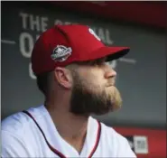  ?? MANUEL BALCE CENETA — ASSOCIATED PRESS FILE ?? Nationals’ Bryce Harper looks out at the field before a game againt the Marlins in Washington last September.