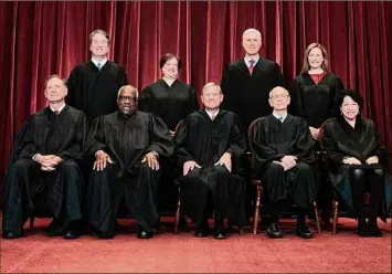 ?? Erin Schaff / Associated Press ?? Members of the Supreme Court pose for a group photo April 23 in Washington. Seated from left are Justices Samuel Alito and Clarence Thomas, Chief Justice John Roberts, Justices Stephen Breyer and Sonia Sotomayor. Standing from left are Justice Brett Kavanaugh, Justice Elena Kagan, Justice Neil Gorsuch and Justice Amy Coney Barrett.