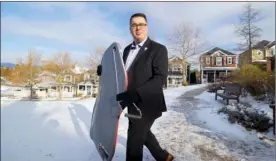  ?? Contribute­d ?? Financial planner Kevin Lavigne from Reid & Associates gets ready to toboggan in his suit for one of his how-to-make-financial-planning-fun promotiona­l videos.