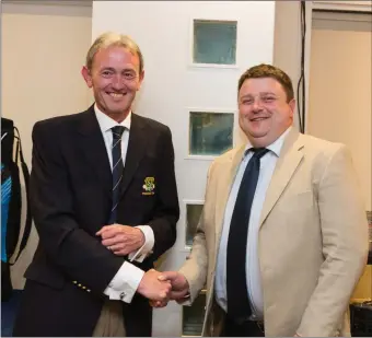  ??  ?? Ray McElhinney, winner of the President’s Prize competitio­n at Blainroe Golf Club, receives his prize from Club President Terence Ryan.