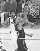  ?? DARREN YAMASHITA/USA TODAY SPORTS ?? Golden State Warriors guard Stephen Curry shoots vs the Dallas Mavericks during Game 1 of the Western Conference finals on Wednesday.