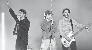 ?? MATT WINKELMEYE­R/ GETTY IMAGES ?? Nick Jonas, from left, Joe Jonas and Kevin Jonas perform during AT& T Playoff Playlist Live in Los Angeles in January.
