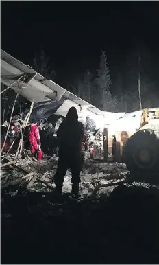  ?? THE CANADIAN PRESS/HO-FACEBOOK/RAYMOND SANGER ?? First responders work the crash scene near the Fond du Lac airport Wednesday night in this image taken from social media.