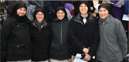  ??  ?? Sisters Therese, Catherine, Philomena, Faustina and Veronica at the Carrying of the Cross procession on Good Friday.