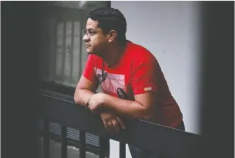  ?? NATRICE MILLER/THE ATLANTA JOURNAL-CONSTITUTI­ON/TNS ?? Klinsman Torres, a 31-year-old migrant from Venezuela, stands outside of the hotel he is living in Sept. 9 after arriving in the Atlanta area via the southern border.