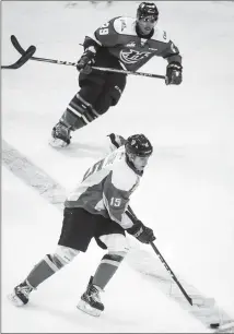  ?? Herald photo by Tijana Martin @TMartinHer­ald ?? Prince Albert Raider forward and Lethbridge product D-Jay Jerome moves the puck up ice during WHL action against the Lethbridge Hurricanes Friday night at the Enmax Centre.