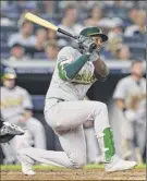  ?? Rich Schultz / Getty images ?? Jurickson Profar hits his goahead two-run double against the Yankees in the sixth inning friday. He had three rbis in the game.