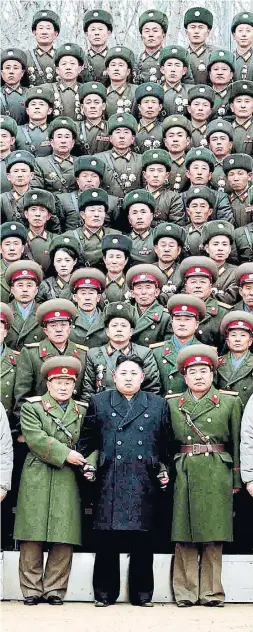  ?? KCNA AFP/GETTY IMAGES FILE PHOTO ?? Kim Jong Un poses with Korean People’s Army soldiers on Jan. 1, 2012, less than a month after the death of his father. Kim’s eldest half-brother, Kim Jong Nam, had once been the favourite to succeed.