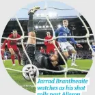  ?? ?? Jarrad Branthwait­e watches as his shot rolls past Alisson