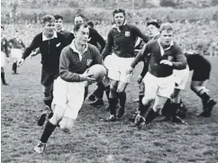  ??  ?? 0 Scrum-half Gus Black playing for the 1950 Lions in New Zealand.