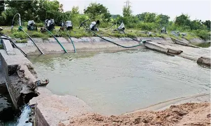  ??  ?? Farmers use diesel water pumps to pull water to their fields (Representa­tional Image)