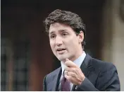  ?? ADRIAN WYLD / THE CANADIAN PRESS ?? Prime Minister Justin Trudeau says a Chinese state-owned company’s bid to take over Calgary constructi­on firm Aecon Group will be reviewed “very carefully” under the Canada Investment Act.