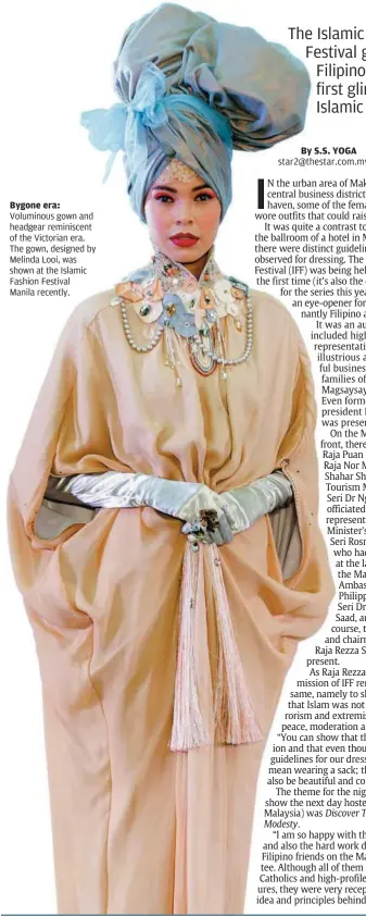  ??  ?? Bygone era: Voluminous gown and headgear reminiscen­t of the Victorian era. The gown, designed by Melinda Looi, was shown at the Islamic Fashion Festival Manila recently.