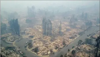  ?? PICTURE: AP ?? An aerial image shows a neighbourh­ood that was destroyed by a fire in Santa Rosa, California. Residents of California wine country took stock of their shattered lives yesterday after deadly wildfires destroyed homes and businesses. At least 17 people...