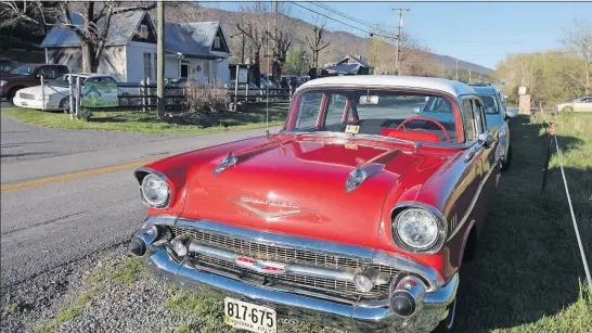  ?? [STEVE STEPHENS/DISPATCH PHOTOS] ?? A vintage car is one of many parked along the highway outside the Carter Family Fold near Hiltons, Va.