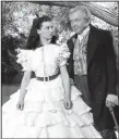  ??  ?? Gerald O’Hara (Thomas Mitchell, right) counsels willful young daughter Scarlett (Vivien Leigh) in an early scene from the Civil War epic Gone With the Wind.