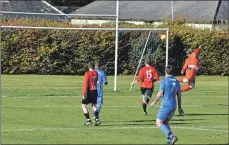  ??  ?? The Killie Athletic goalkeeper leaps into the air in an attempt to prevent another Arran goal.