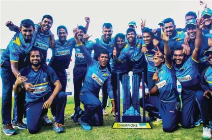  ??  ?? BULAWAYO: Sri Lanka’s players celebrate victory after the final of the Blue Mountain Achilleion tri-series played between Sri Lanka and hosts Zimbabwe at the Queens Sports Club in Bulawayo, yesterday. — AFP