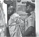  ?? ELIZABETH ROBERTSON/THE PHILADELPH­IA INQUIRER/VIA AP ?? Police take suspect Maurice Hill into custody after a standoff with police that wounded several police officers, in Philadelph­ia.