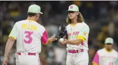  ?? AP photo ?? Padres closer Josh Hader hands the ball to manager Bob Melvin as he is taken out during the ninth inning Friday.