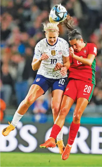 ?? ?? ABOVE: The United States’ Lindsey Horan, left, and Portugal’s Kika Nazareth battle for the ball Tuesday during the Women’s World Cup in Auckland, New Zealand. Team co-captain Horan is rallying her teammates.
